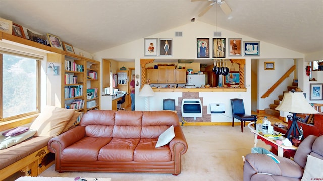 living area featuring ceiling fan, vaulted ceiling with beams, carpet, and stairs