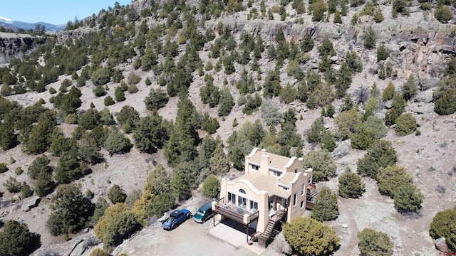 birds eye view of property with a mountain view