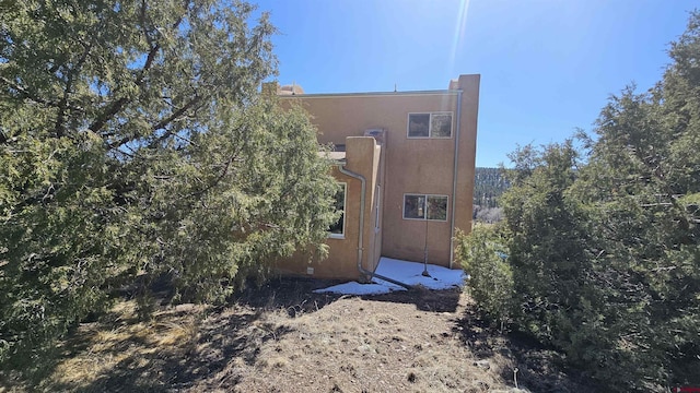 view of side of home featuring stucco siding