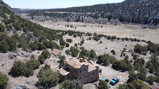 birds eye view of property with a rural view