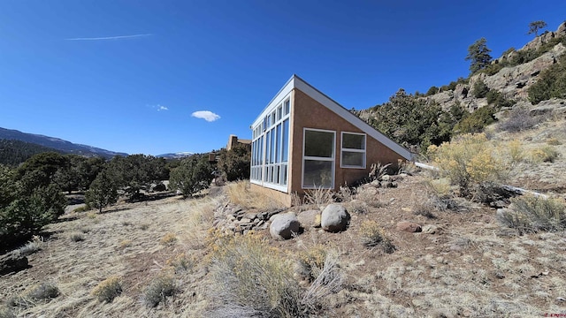 view of property exterior with stucco siding