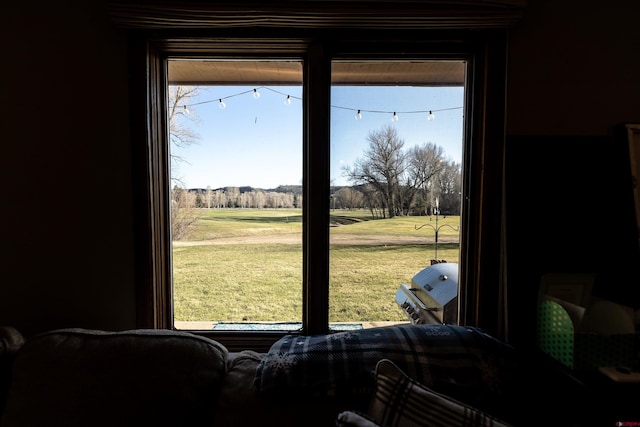 107 Shavano Dr Unit A1, Gunnison, CO 81230 - doorway to outside with view of golf course and a wealth of natural light