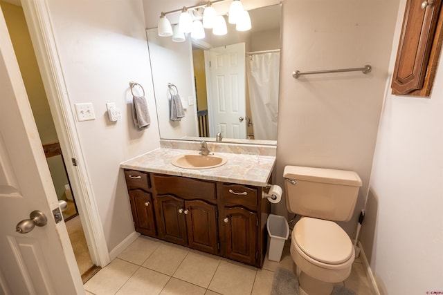107 Shavano Dr Unit A1, Gunnison, CO 81230 - bathroom with toilet, tile patterned floors, vanity, and baseboards