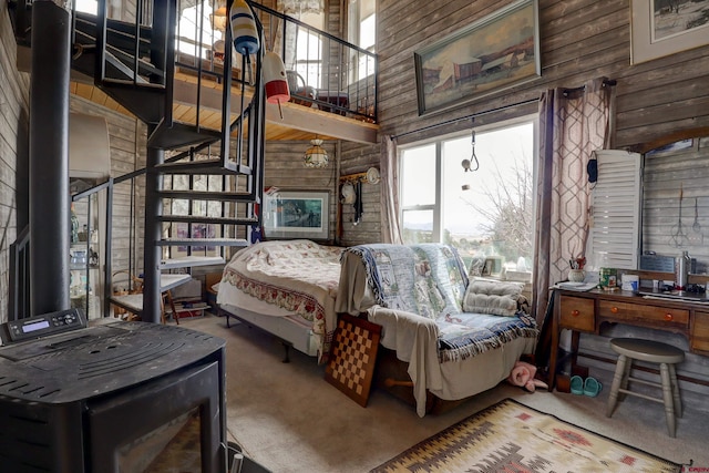 18725 Rd 25.8, Dolores, CO 81323 - carpeted bedroom featuring wood walls and a high ceiling
