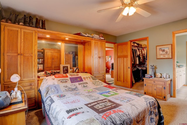 18725 Rd 25.8, Dolores, CO 81323 - carpeted bedroom with a closet, ceiling fan, a walk in closet, and connected bathroom