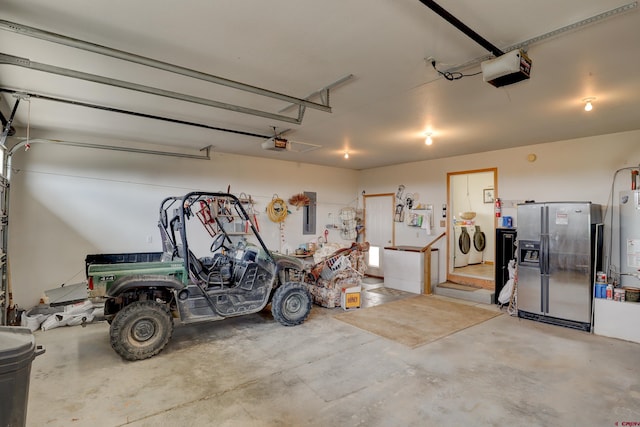 18725 Rd 25.8, Dolores, CO 81323 - garage featuring stainless steel fridge with ice dispenser, independent washer and dryer, gas water heater, and a garage door opener
