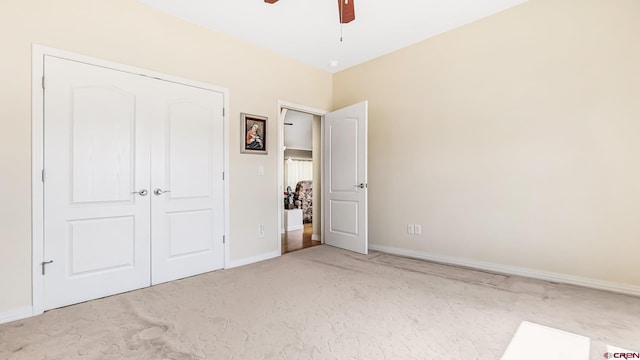 unfurnished bedroom with carpet floors, baseboards, and ceiling fan