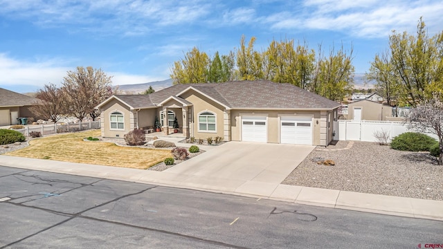 ranch-style house featuring concrete driveway, stucco siding, a front yard, a garage, and fence