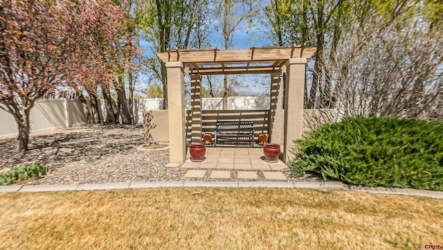 view of patio with a fenced backyard and a pergola