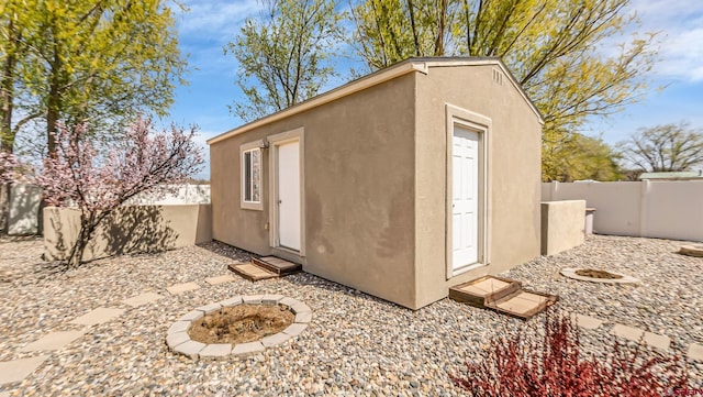 view of outdoor structure with an outbuilding and a fenced backyard