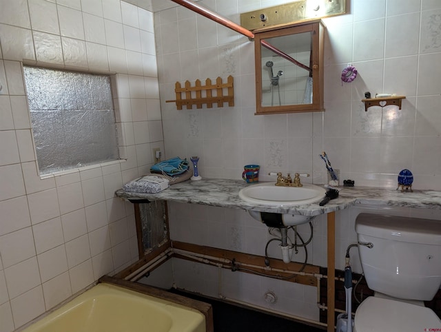 407 Simmons Dr, Pagosa Springs, CO 81147 - bathroom with toilet, tasteful backsplash, and tile walls