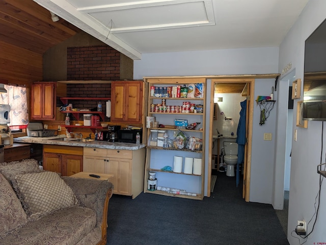 407 Simmons Dr, Pagosa Springs, CO 81147 - kitchen with dark carpet, a sink, light countertops, and vaulted ceiling