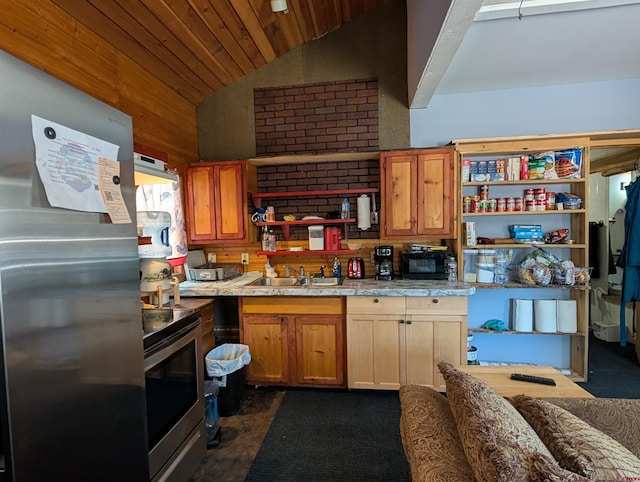 407 Simmons Dr, Pagosa Springs, CO 81147 - kitchen featuring open shelves, appliances with stainless steel finishes, a sink, light countertops, and lofted ceiling