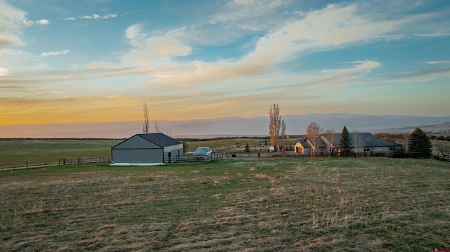 37835 Fruitland Mesa Dr, Crawford, CO 81415 - view of yard featuring a rural view, a barn, an outdoor structure, and fence