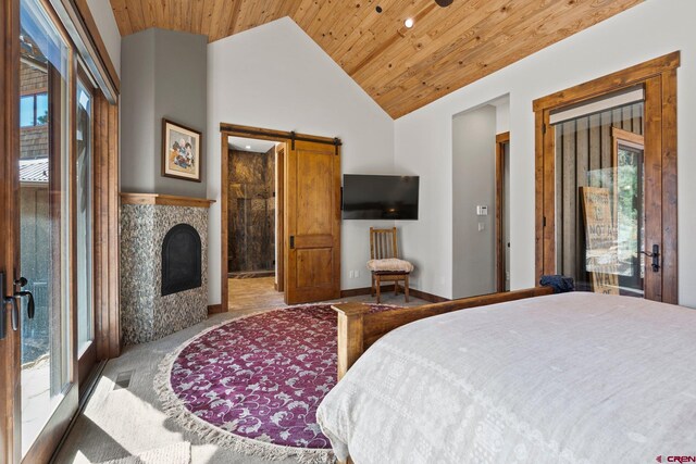 carpeted bedroom with high vaulted ceiling, a barn door, access to outside, and wooden ceiling