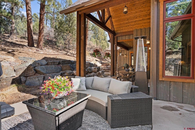 view of patio / terrace with an outdoor living space and fence