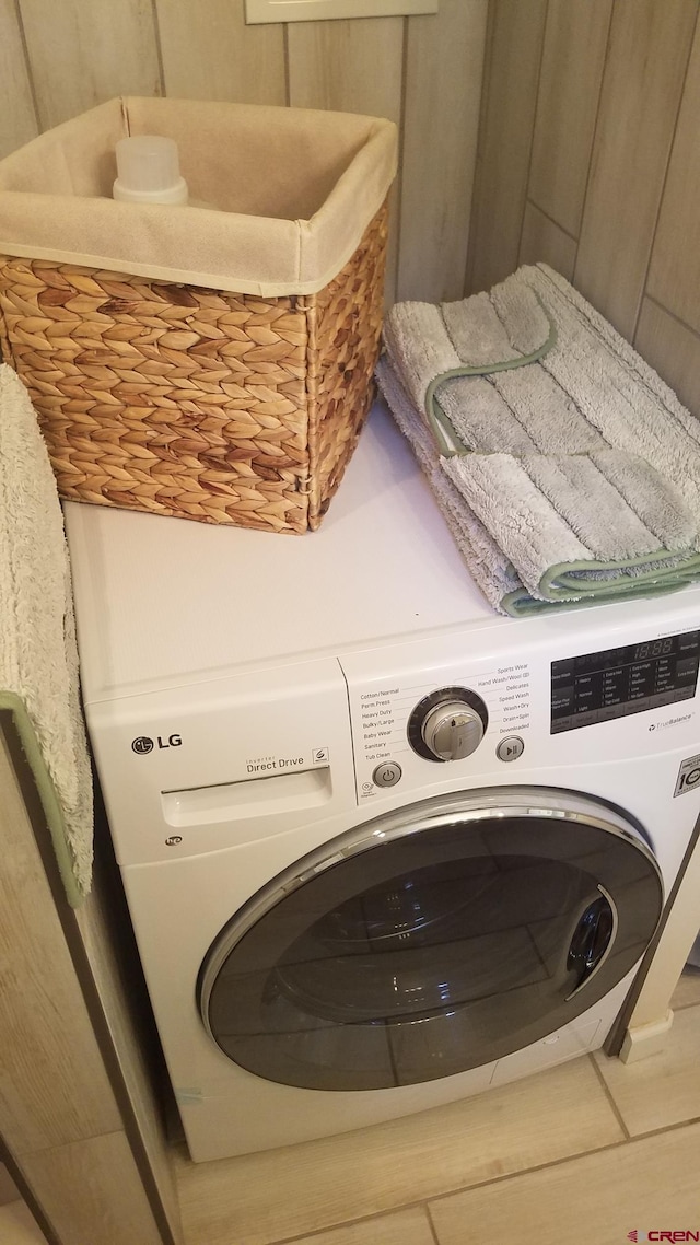 washroom with washer / dryer