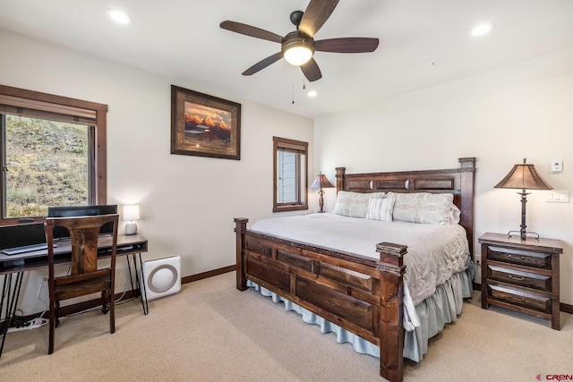 bedroom with multiple windows, light colored carpet, and recessed lighting