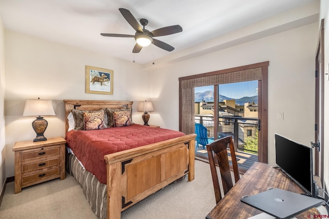 bedroom featuring access to exterior, a ceiling fan, and light colored carpet