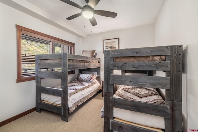bedroom with baseboards, a ceiling fan, and carpet flooring