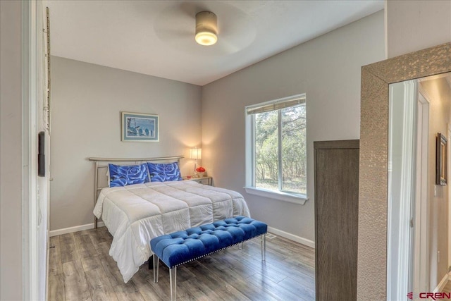 80 Cleek Ct, Pagosa Springs, CO 81147 - bedroom featuring baseboards, a ceiling fan, and wood finished floors