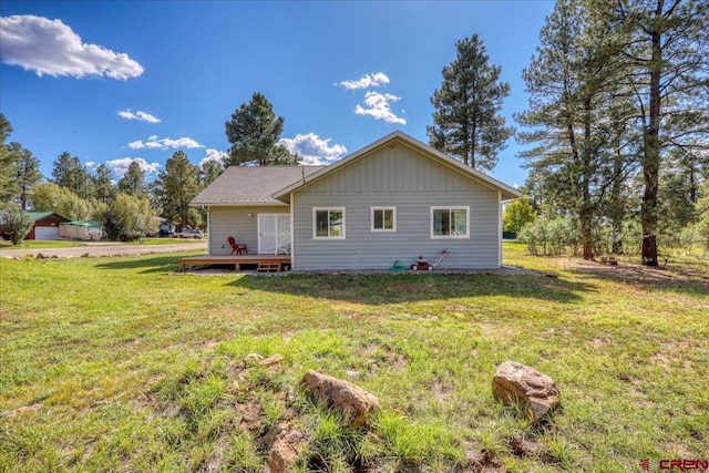 80 Cleek Ct, Pagosa Springs, CO 81147 - back of house with a deck and a lawn