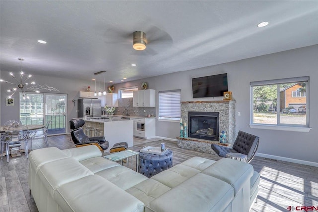 80 Cleek Ct, Pagosa Springs, CO 81147 - living room with a wealth of natural light, light wood-type flooring, and baseboards