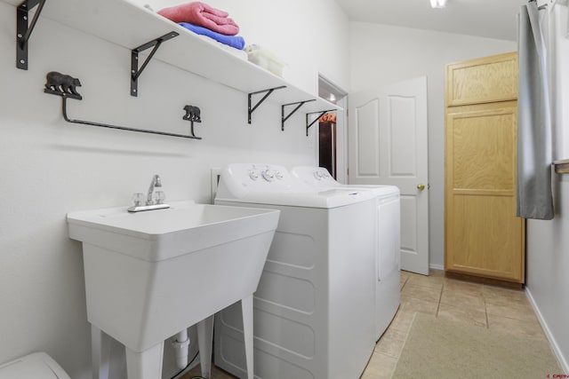 85 Dayspring Pl, Pagosa Springs, CO 81147 - laundry room with light tile patterned floors, washing machine and dryer, a sink, and cabinet space
