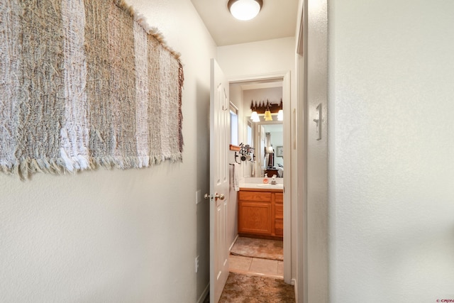 85 Dayspring Pl, Pagosa Springs, CO 81147 - hall featuring a sink and tile patterned floors