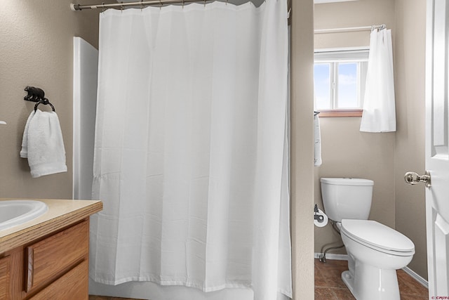 85 Dayspring Pl, Pagosa Springs, CO 81147 - full bathroom featuring baseboards, a shower with curtain, toilet, vanity, and tile patterned flooring