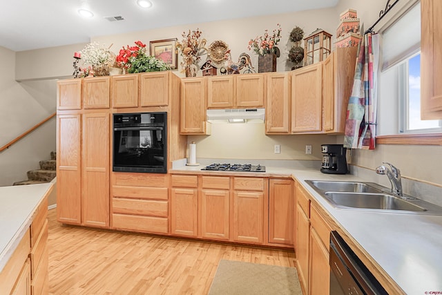 85 Dayspring Pl, Pagosa Springs, CO 81147 - kitchen featuring a sink, light brown cabinetry, under cabinet range hood, black appliances, and light wood-style flooring