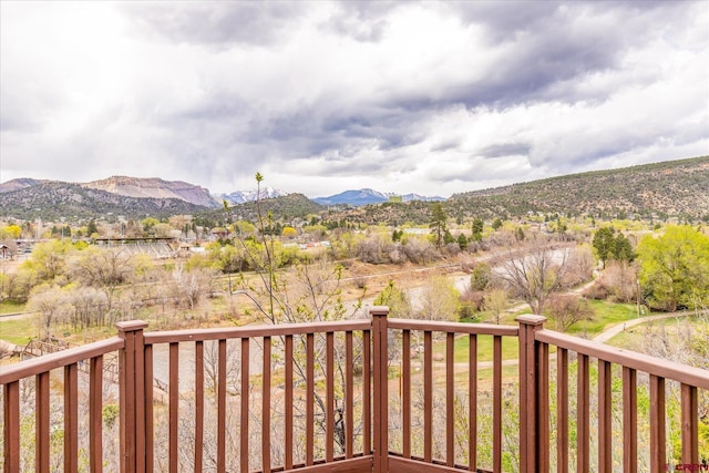wooden terrace with a mountain view