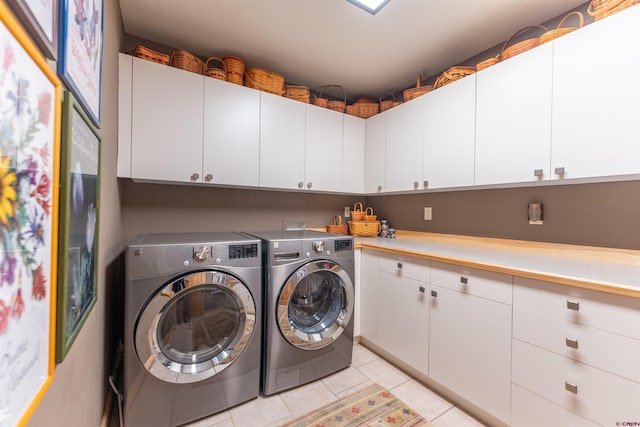 138 Silver Sage Dr, Crested Butte, CO 81224 - washroom with separate washer and dryer, cabinet space, and light tile patterned floors