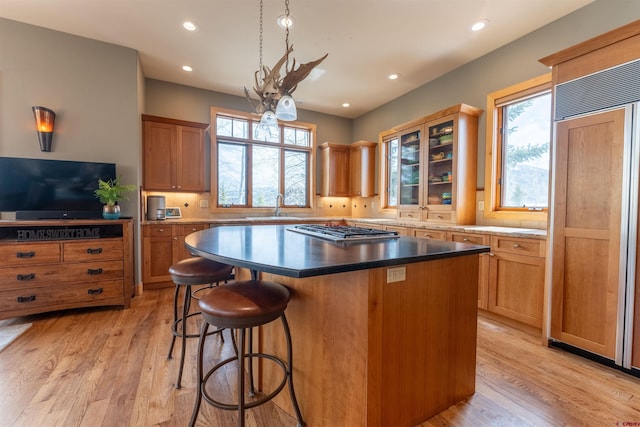 138 Silver Sage Dr, Crested Butte, CO 81224 - kitchen featuring light wood finished floors, paneled fridge, recessed lighting, and a kitchen island