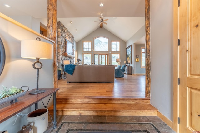 138 Silver Sage Dr, Crested Butte, CO 81224 - living room with lofted ceiling, wood finished floors, baseboards, and ceiling fan