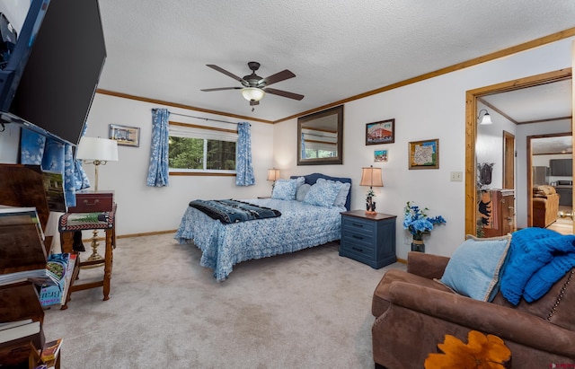 carpeted bedroom featuring a textured ceiling, crown molding, baseboards, and ceiling fan