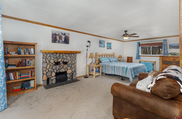 carpeted bedroom featuring a ceiling fan, a stone fireplace, a textured ceiling, and ornamental molding