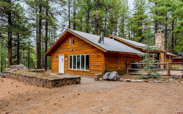 back of property with metal roof