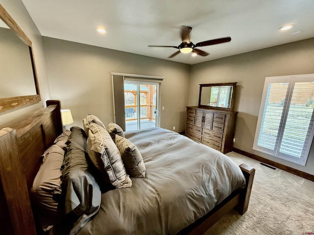 bedroom with access to exterior, baseboards, visible vents, light colored carpet, and a ceiling fan