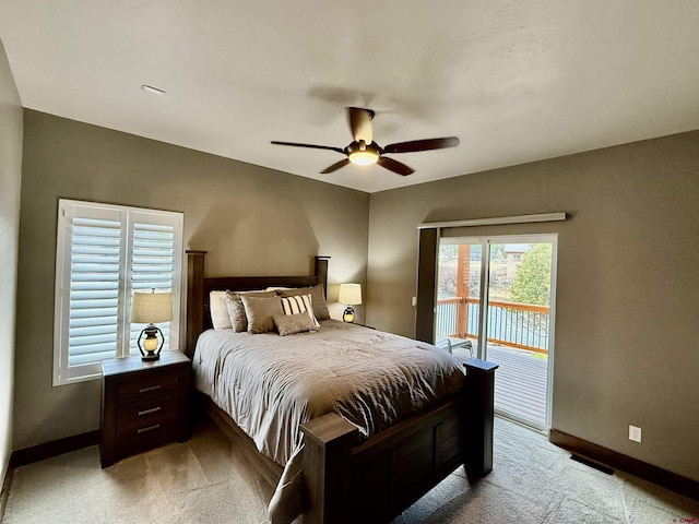 bedroom featuring access to exterior, a ceiling fan, baseboards, and light carpet
