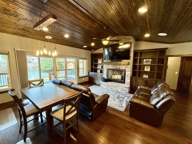 living area with wooden ceiling, a stone fireplace, a wealth of natural light, and vaulted ceiling