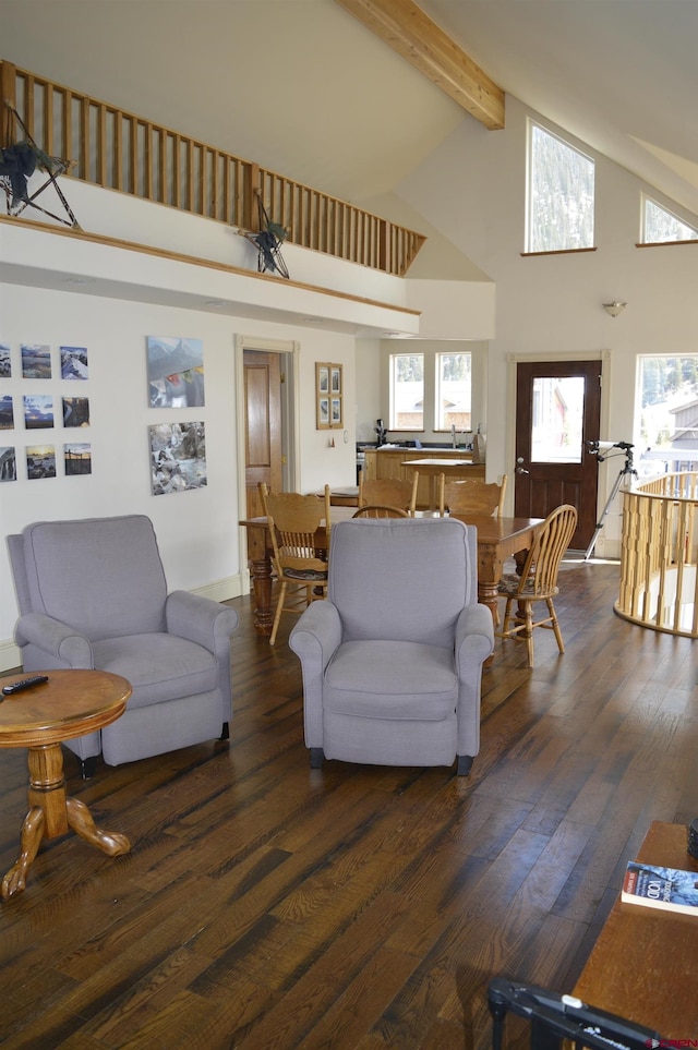 1125 Cement St, Silverton, CO 81433 - living room with high vaulted ceiling, beamed ceiling, and dark wood-type flooring
