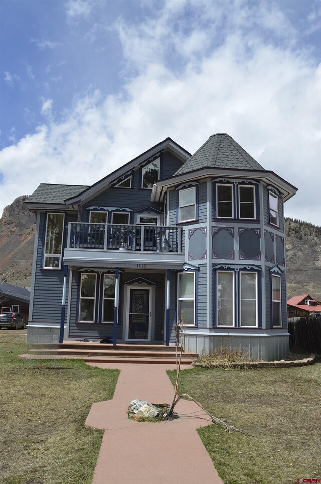 1125 Cement St, Silverton, CO 81433 - view of front of home featuring a balcony and a front yard