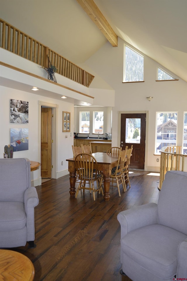 1125 Cement St, Silverton, CO 81433 - living room featuring high vaulted ceiling, hardwood / wood-style floors, beamed ceiling, baseboards, and plenty of natural light