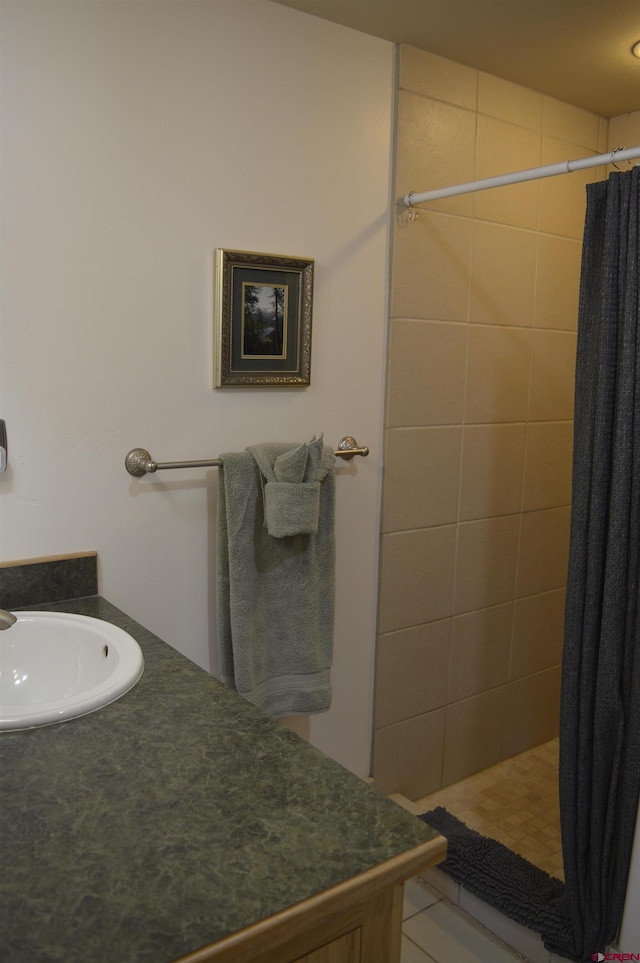 1125 Cement St, Silverton, CO 81433 - full bathroom with tiled shower, vanity, and tile patterned floors