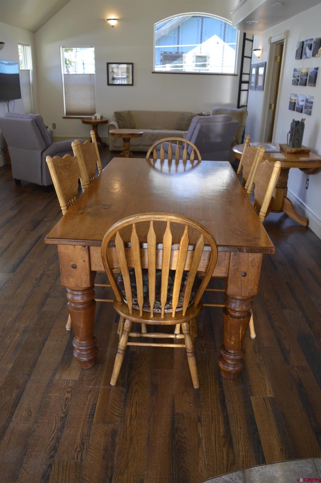 1125 Cement St, Silverton, CO 81433 - dining room with dark wood-style floors, vaulted ceiling, and baseboards