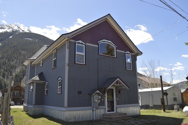 1125 Cement St, Silverton, CO 81433 - view of front of property featuring a mountain view and a front yard