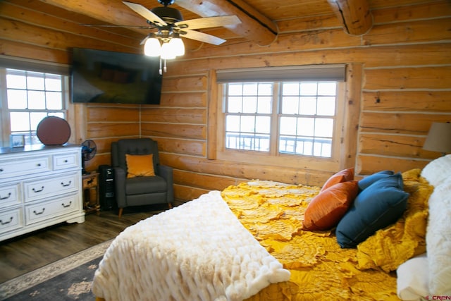 bedroom featuring wood ceiling, wood finished floors, beam ceiling, and rustic walls