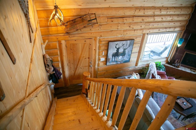 staircase featuring hardwood / wood-style flooring