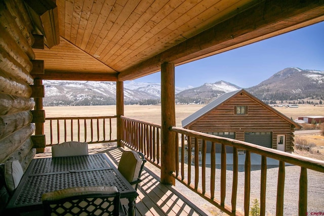 wooden terrace with a mountain view